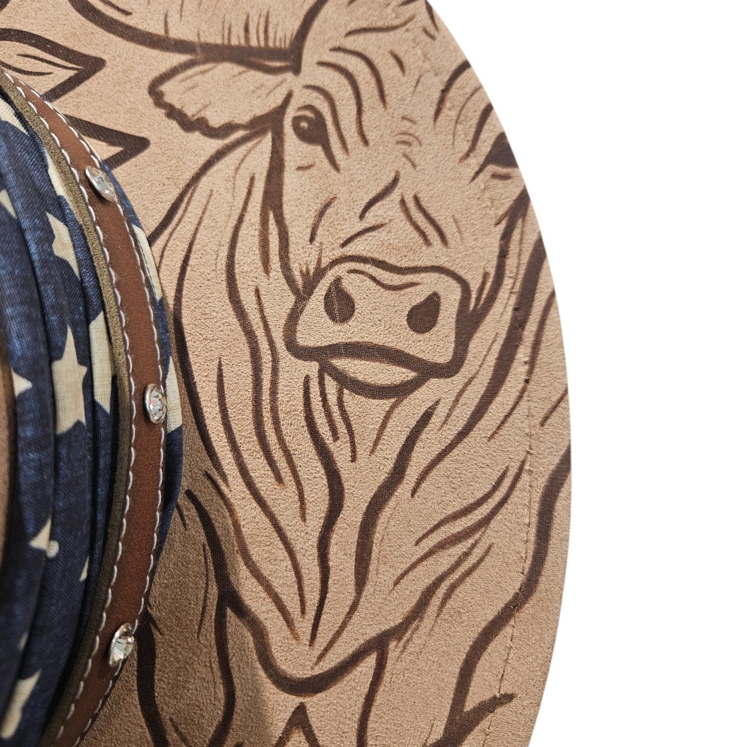Close up detail of laser engraved longhorn on Texas Strong rancher hat