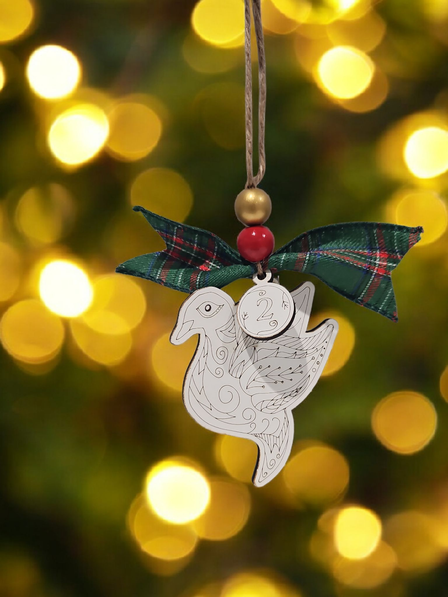 Day 2 two turtle doves engraved white wood Christmas ornament hanging on Christmas tree with bow and bead