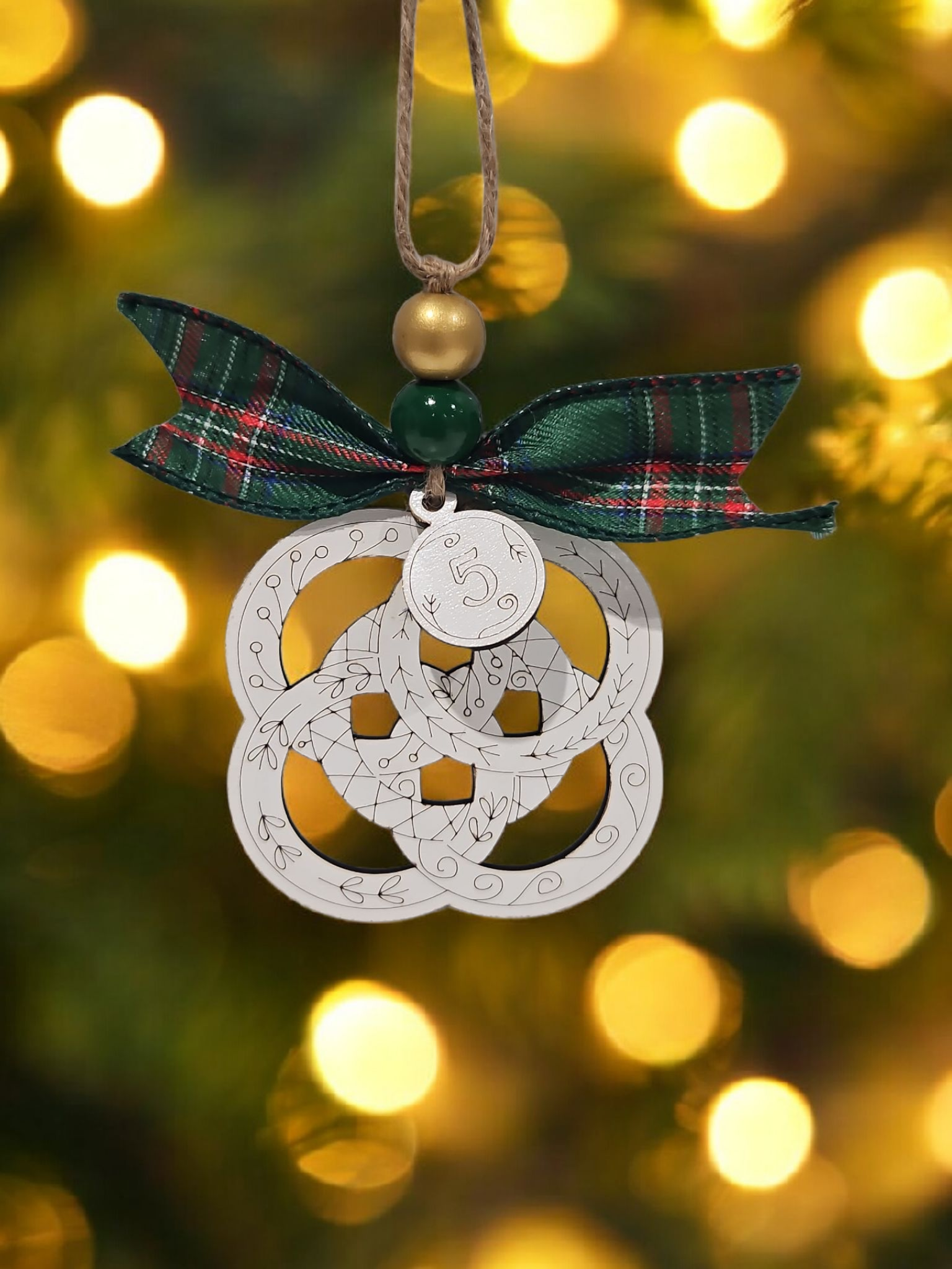 Day 5 five gold rings engraved white wood Christmas ornament hanging on Christmas tree with bow and bead