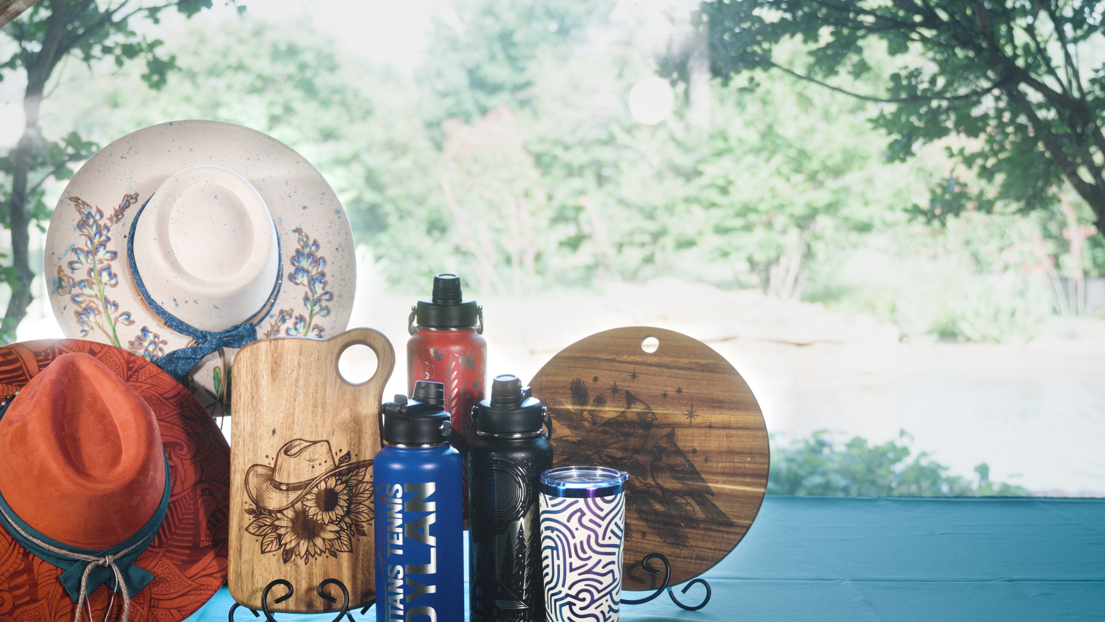 Handcrafted laser-engraved and hand painted products by Ratchet Arts Designs;  personalized hats, tumblers, and cutting boards made in the Dallas-Fort Worth area