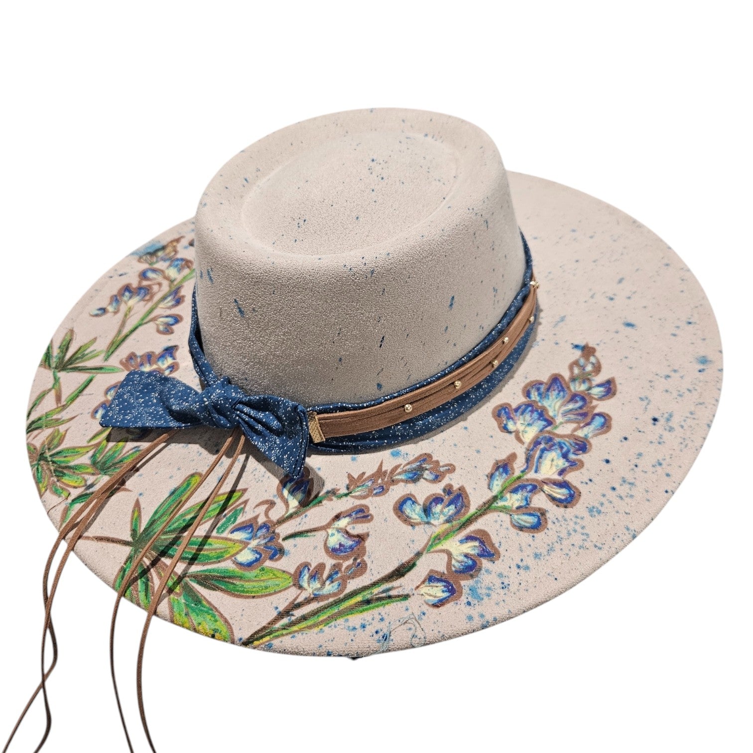 Rancher round top hat showing batik fabric band and hand-painted bluebonnet design on white background